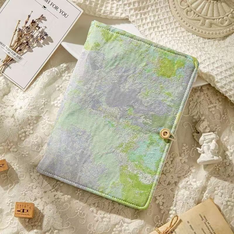 Loose-leaf notebook with fabric cover and 90 blank inner pages